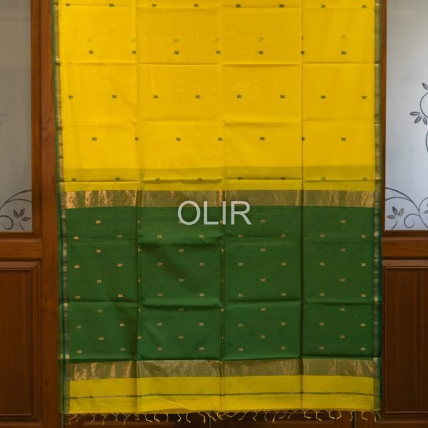 Bright Yellow with thin Dark Green zari border and dark green Pallu